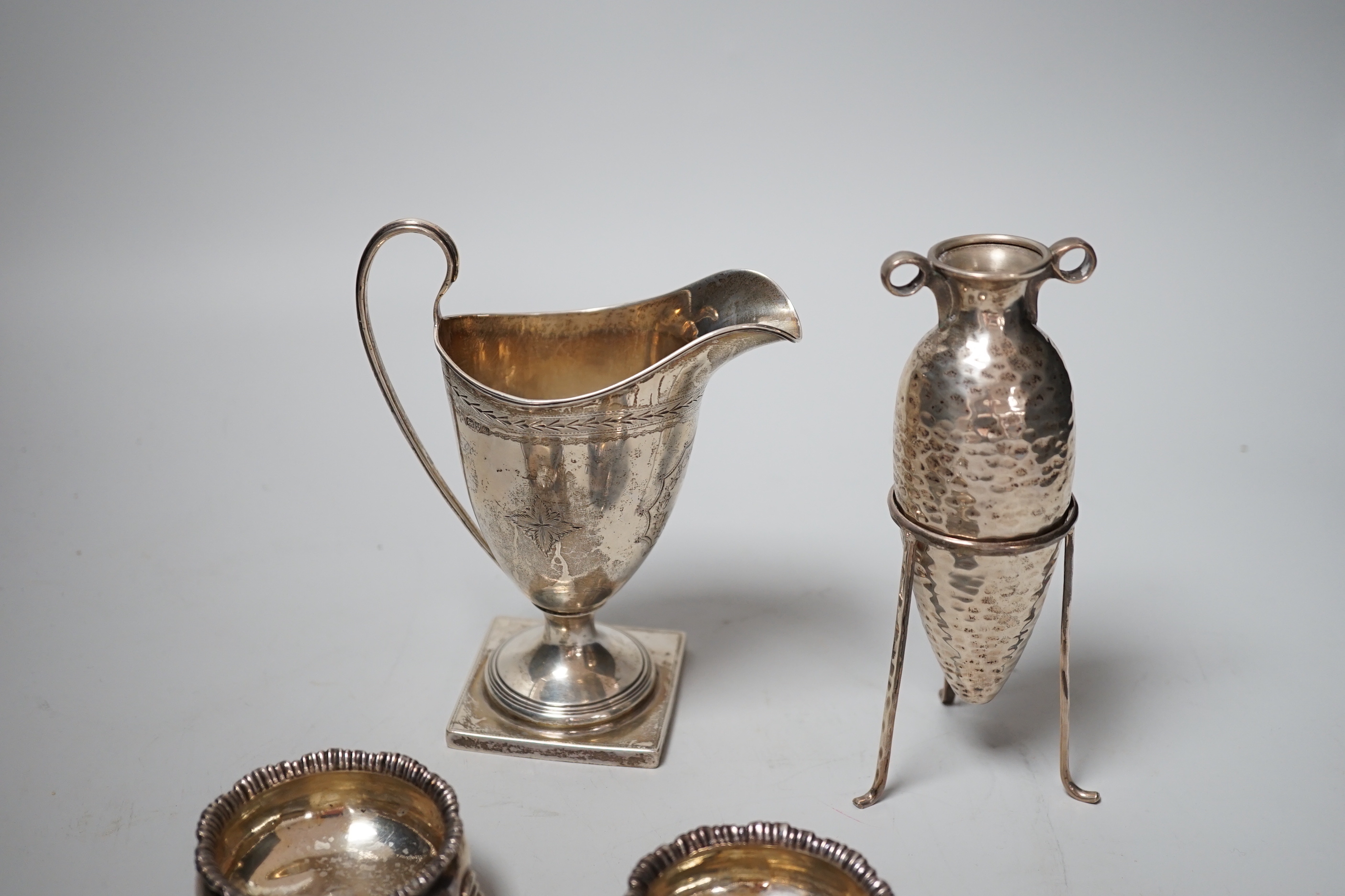 A pair of George III silver salts, London, 1778 and two later spoons, an Edwardian silver cream jug and a 925 specimen vase on stand.